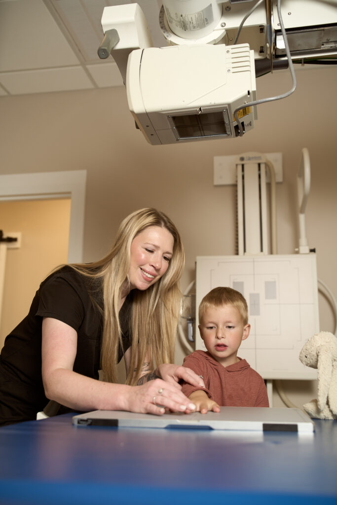 Radiologic technologist preparing a patient for an X-ray at Hitchcock Direct Imaging in Hixson.