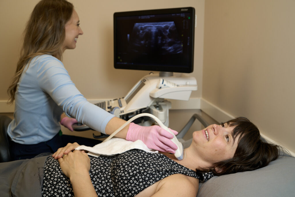 Ultrasound Tech scanning patient